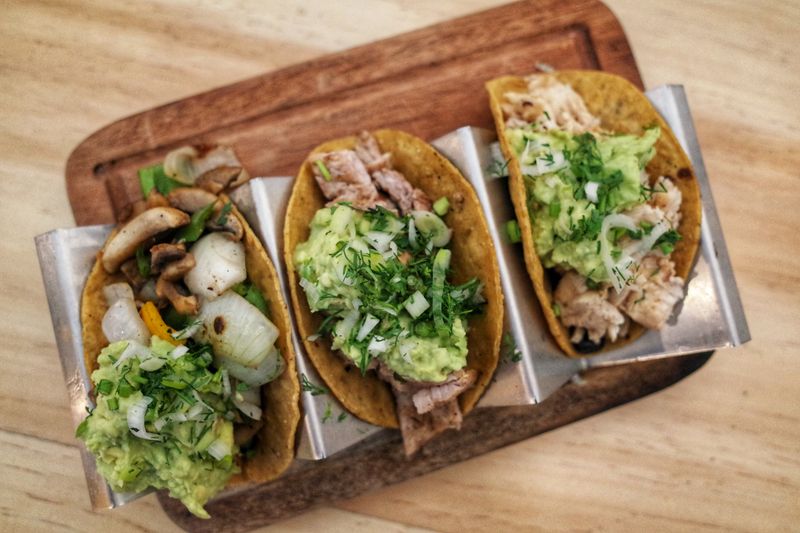 Slow-cooked carnitas tacos with pickled red onion